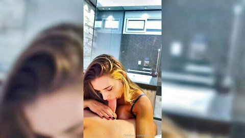 Blonde teen in bikini giving steamy blowjob