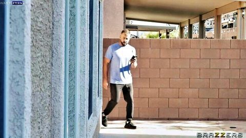 Man sneaking outdoors on phone in Lulu Chu's house arrest Brazzers scene