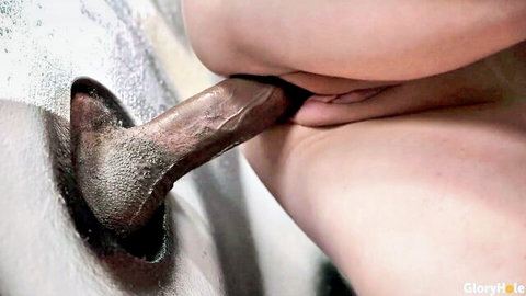 Eva Nyx sucks BBC through glory hole in intense oral scene