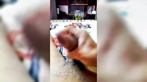 Blurry amateur handjob close-up on colorful sheets
