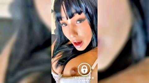 Latino trans woman in white lingerie teases with open mouth on video call