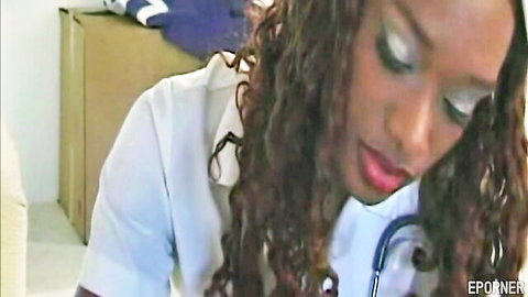 Sexy ebony nurse in white uniform with stethoscope gives seductive closeup gaze