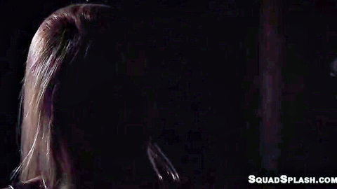 Shadowy blonde with long hair squats topless in dark room on SquadSplash