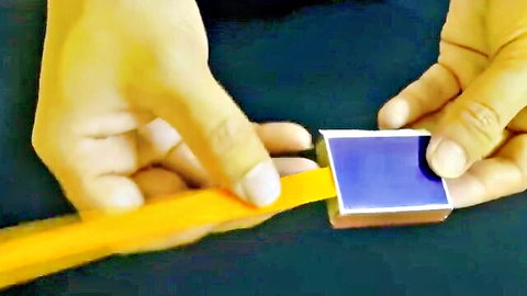 Hands demo magic trick with pencil and blue card in home porn setup
