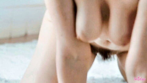 Lilly Bell nude in oily bath, seductive breast-cupping pose