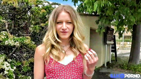 Sensual blonde in floral dress teasing cleavage outdoors with small tits
