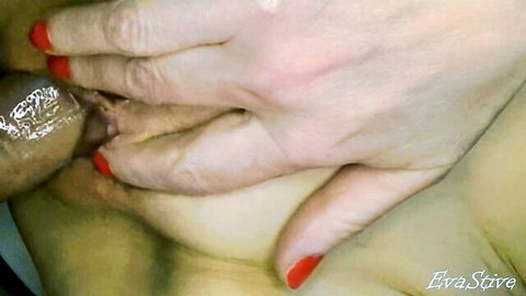 Mature hands guiding cock into wet pussy close-up