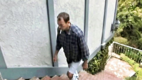 Man in plaid shirt and shorts walking up outdoor stairs to MILF cowgirl scene with Alexis Texas and Kagney Linn Karter