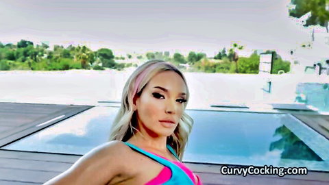 Busty blonde in skimpy pink bikini teasing her big tits poolside outdoors