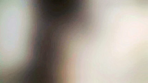 Blurry closeup of nude skin tones and motion blur suggesting amateur sex action.