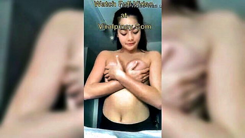 Honey Lou Filipina teen topless covering breasts in bathroom mirror