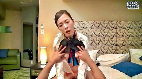 Asian big-titted flight attendant holding exposed breasts in JAV creampie scene
