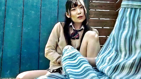 Asian schoolgirl in uniform spreading legs teasingly