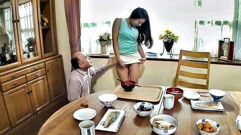 Old man hikes up young Japanese woman's miniskirt exposing her bare pussy and ass at dinner table