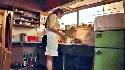 Japanese MILF in apron bends over kitchen sink washing dishes teasing big tits