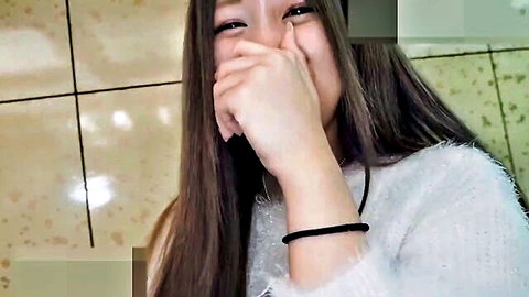 Beautiful Japanese woman laughing, covered mouth, long hair, white sweater POV JAV thumbnail