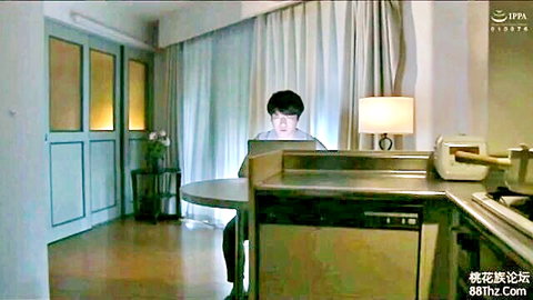Asian man in dark attire working on laptop in JAV mother-in-law scene VKO-1316