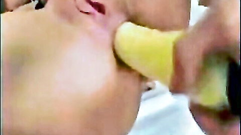 Submissive Caucasian woman deepthroating banana in slave roleplay