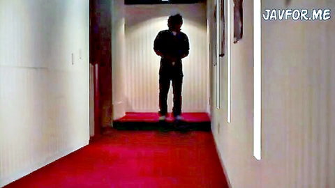 Silhouetted Japanese woman in shadowy hallway, teasing nighttime JAV seduction