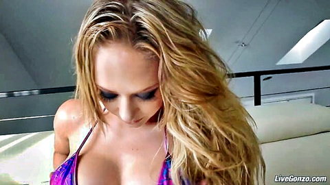 Kagney Linn Karter busty blonde in purple bikini showing cleavage