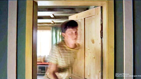 Young man peeking through door in Sex Education season 2 scene