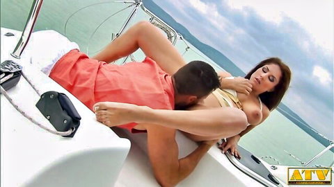 Tanned brunette babe rides hard cock reverse cowgirl on yacht deck with pussy stretched wide