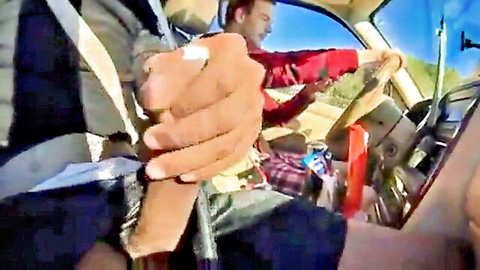 Gay dude grabs driver's cock bulge through pants while cruising in sunny van outdoors