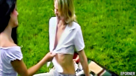 Amberlina Lynn and Nicole Leshelle lesbian outdoor tease with open shirts exposing breasts