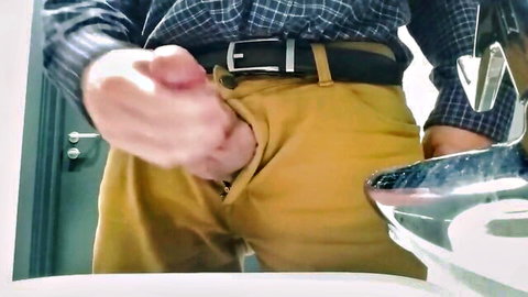 DILF daddy stroking his cock inside open fly of yellow pants in bathroom mirror