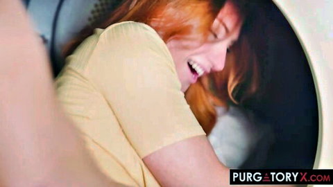 Redhead woman smiling joyfully inside washing machine drum wearing yellow top