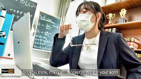 Asian JAV teacher in suit and mask, seductive classroom pose