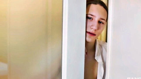 Skinny young teen with small tits peeking topless through open bathroom door