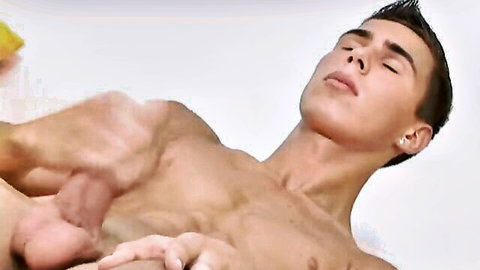 Cute twink getting handjob with muscular body exposed