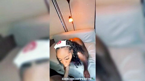 Thick ebony nurse in hat nude on bed with massive ass grabbed by hand