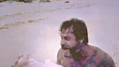 Shannon Ashlyn nude tits on beach with bearded man in Emissary 2014
