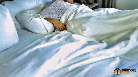 Seductive woman sharing bed, teasing ass in sheer mesh top