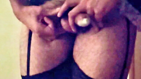 Hairy ass in black lingerie gets penetrated by thick white dildo closeup