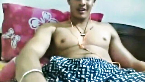 Young shirtless South Asian hunk with muscular chest smiling in checkered shorts amateur webcam solo