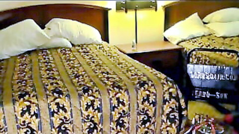 Mistress Lora in hotel room for cuckold cleanup scene, bedroom setup