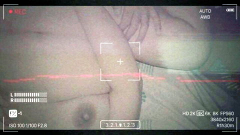 Amateur POV camcorder closeup of woman's pale tit and erect nipple exposed