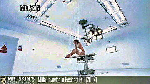 Milla Jovovich nude on surgical table spreading legs exposing shaved pussy and small tits