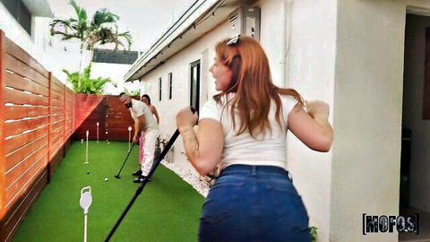 Redhead babe in tight jeans shows off ass during golf swing with Jimmy Michaels, Mofos resort
