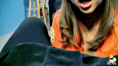 Riley Reid in seductive POV close-up, mouth open in orange top