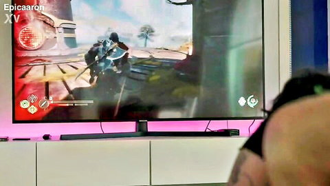 Gamer sitting in front of TV screen playing Star Wars Battlefront with Picaron watermark