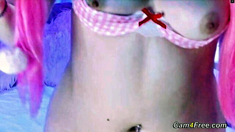 Pink-haired slim girl topless in checkered apron, navel piercing, teasing body