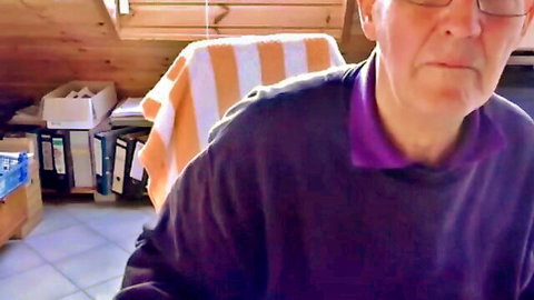 74-year-old German silver daddy in purple sweater posing casually