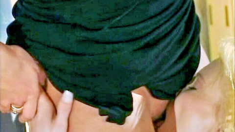 Blonde babe lifts brunette maid's green skirt exposing her smooth thighs and ass