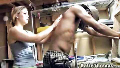 Blonde babe in tank top caresses muscular black stud's ripped back in garage interracial tease