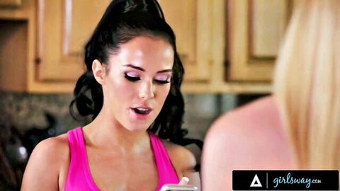 Adriana Chechik and Megan Rain in pink tank top, intense eye contact