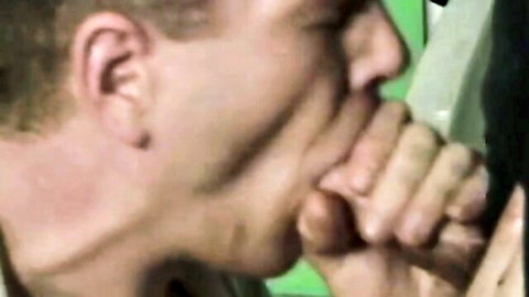 Close-up of man eagerly sucking large cock in intense oral scene